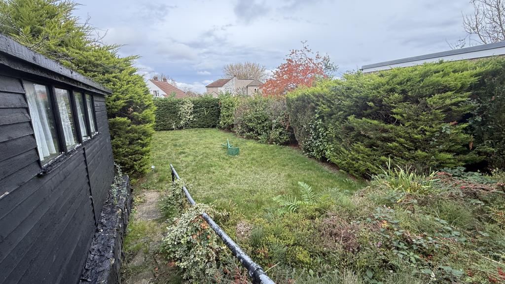 Lot: 62 - SEMI-DETACHED BUNGALOW WITH POTENTIAL - External image of garden from back of bungalow